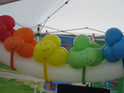 row of rainbow bug balloons