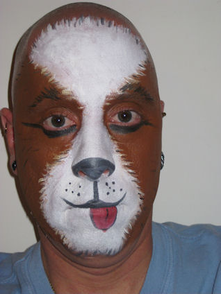 Adult with his face painted like a dog