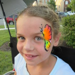 Girl with a butterfly design at the Friday Night Concerts in South Riding