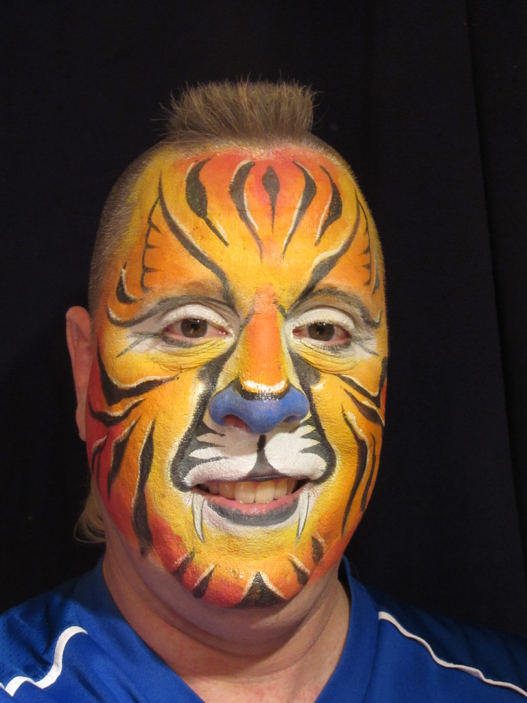 Mike with his face painted like a tiger