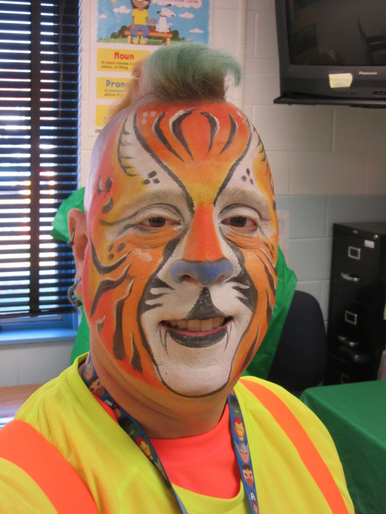 Mike with his face painted like a tiger